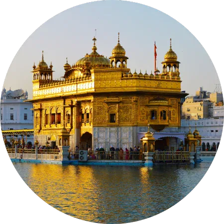 Golden Temple in Amritsar glowing in the evening light, a spiritual gem of luxury India tours