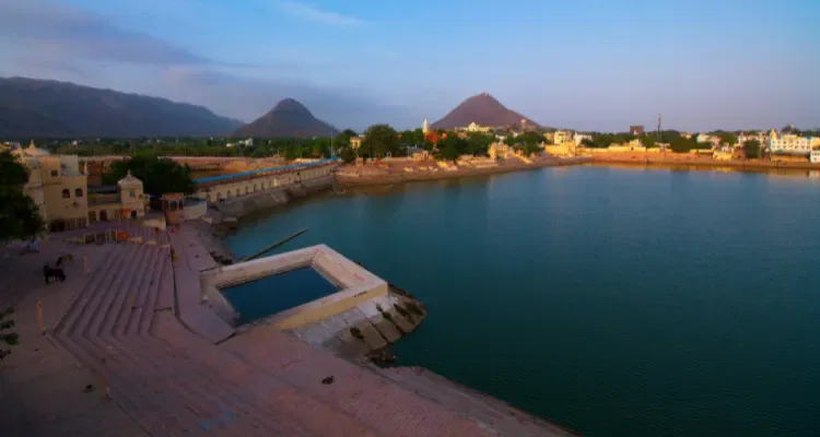 Golden Triangle Tour with Pushkar, featuring a scenic view of Pushkar Lake with ghats and hills