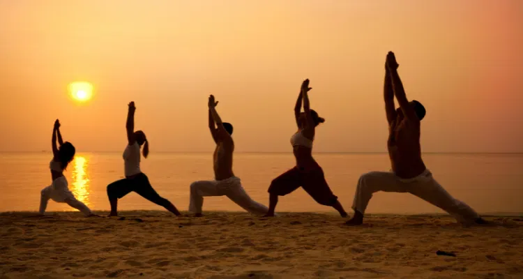 Luxury Golden Triangle Tour 11 Days with Yoga, featuring a serene beach yoga session at sunrise
