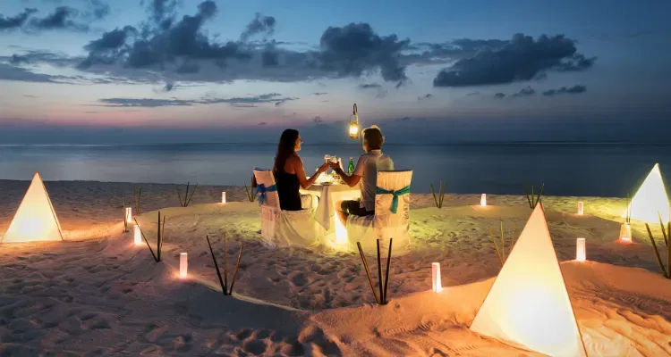 Romantic private beach dinner at sunset, highlight of India luxury private tours