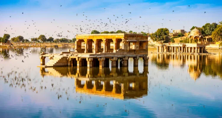 Scenic view of Gadisar Lake in Jaisalmer, part of Rajasthan tour packages exploring temples and Ghats