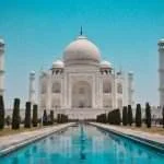 Taj Mahal at sunrise - iconic symbol of love and highlight of India's Golden Triangle tour