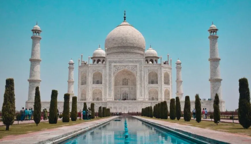 Taj Mahal at sunrise - iconic symbol of love and highlight of India's Golden Triangle tour