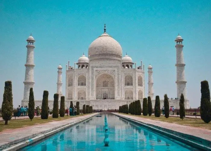 Taj Mahal at sunrise - iconic symbol of love and highlight of India's Golden Triangle tour