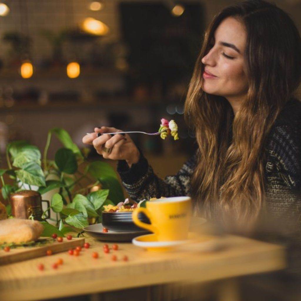 a woman enjoying her food